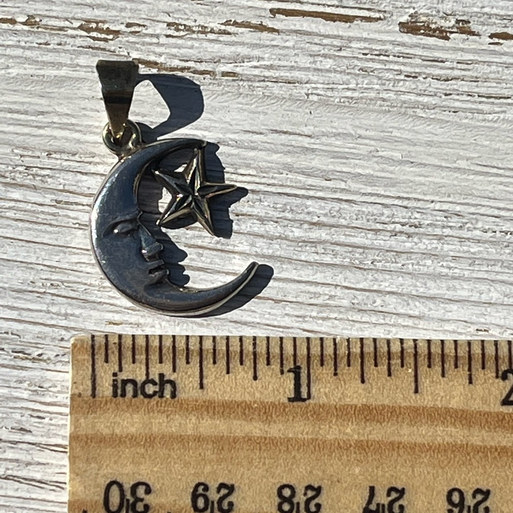 Sterling silver 925 moon and star pendant. Crescent moon with face.